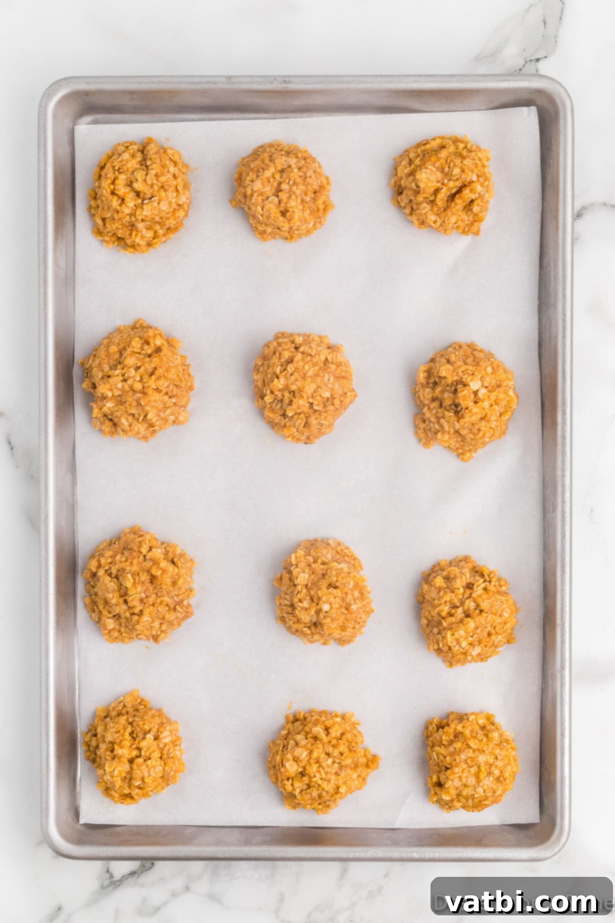 No-Bake Pumpkin Spice Treats 8 Cookies scooped on baking sheet.