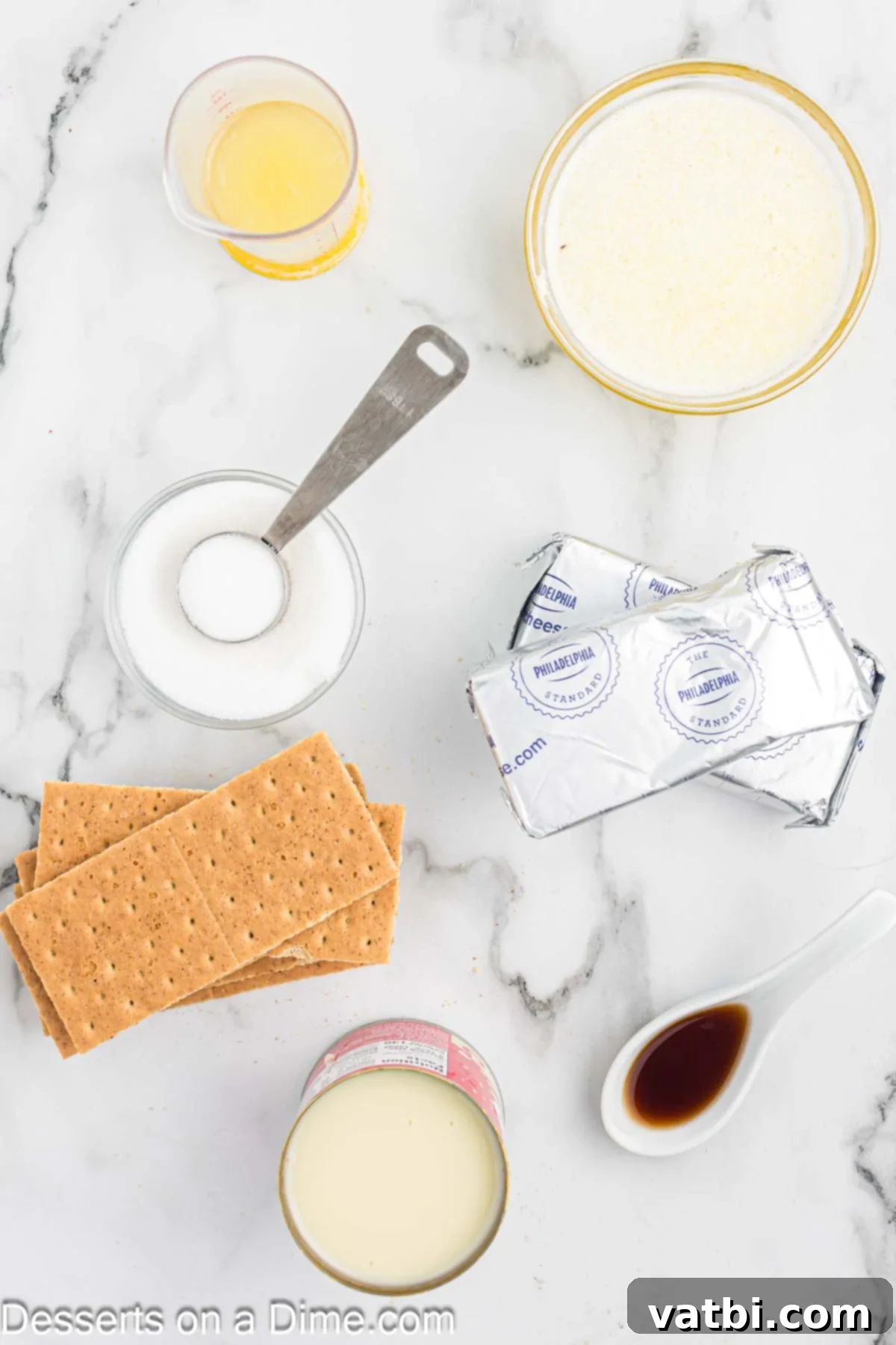 Effortless No-Bake Cheesecake 3 Ingredients for no bake cheesecake including graham crackers, cream cheese, sweetened condensed milk, lemon juice, and vanilla extract.