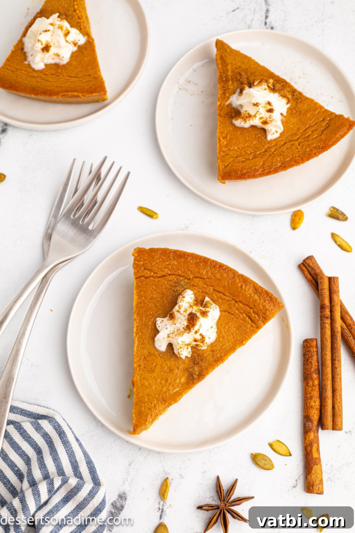 Velvet Pumpkin Pudding Pie 11 Crustless pumpkin pie, ready to be served, with a spoon in the background.