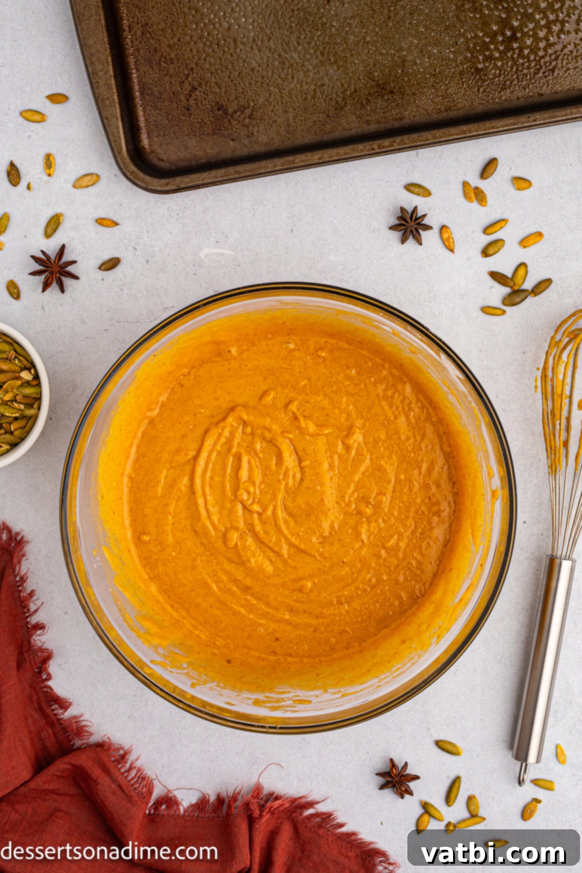 Harvest Pumpkin Sheet Cake 5 Pumpkin puree combined with wet ingredients in a bowl, showing a smooth mixture.