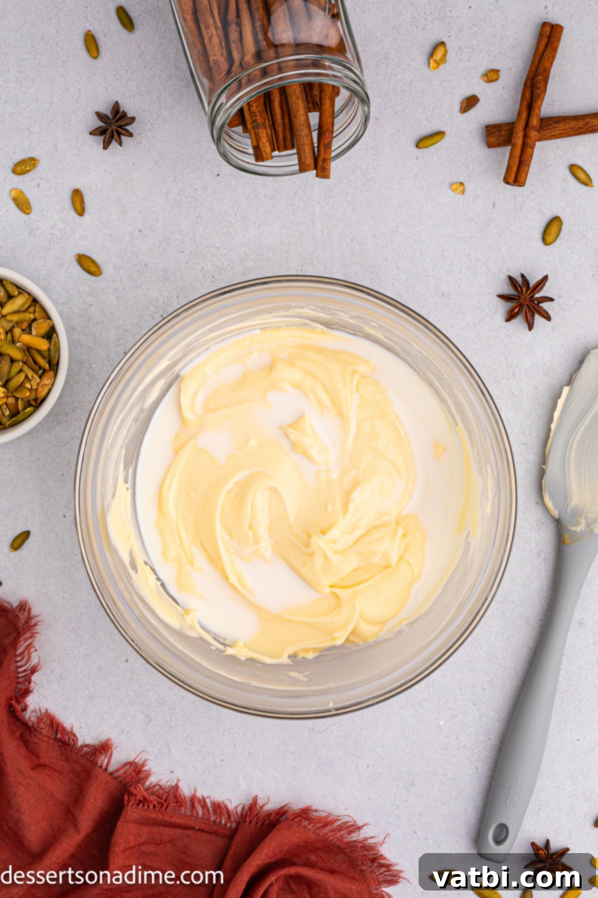 Harvest Pumpkin Sheet Cake 7 Frosting ingredients in a bowl, including softened butter, cream cheese, and powdered sugar, ready to be combined.
