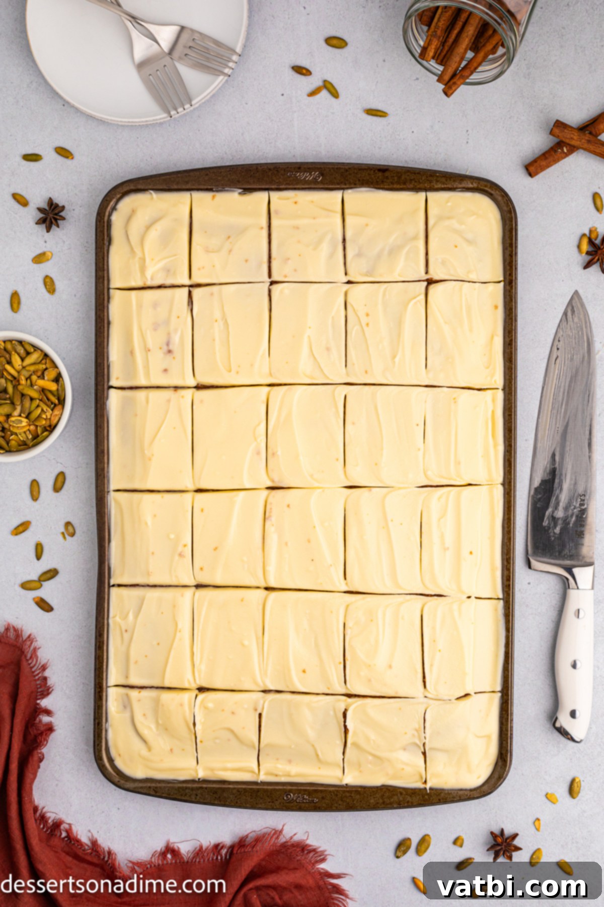 Harvest Pumpkin Sheet Cake 9 Pumpkin sheet cake neatly cut into individual squares, ready to be served.