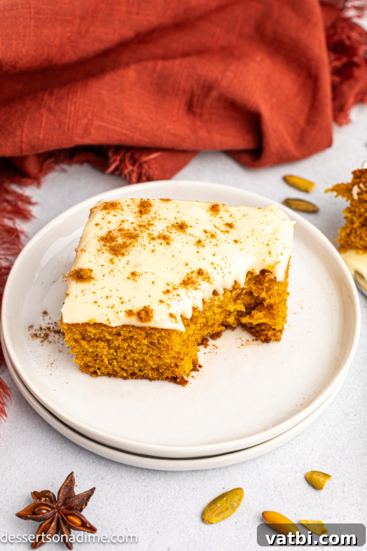 Harvest Pumpkin Sheet Cake 10 Another close-up of a pumpkin cake slice on a plate, highlighting the texture.