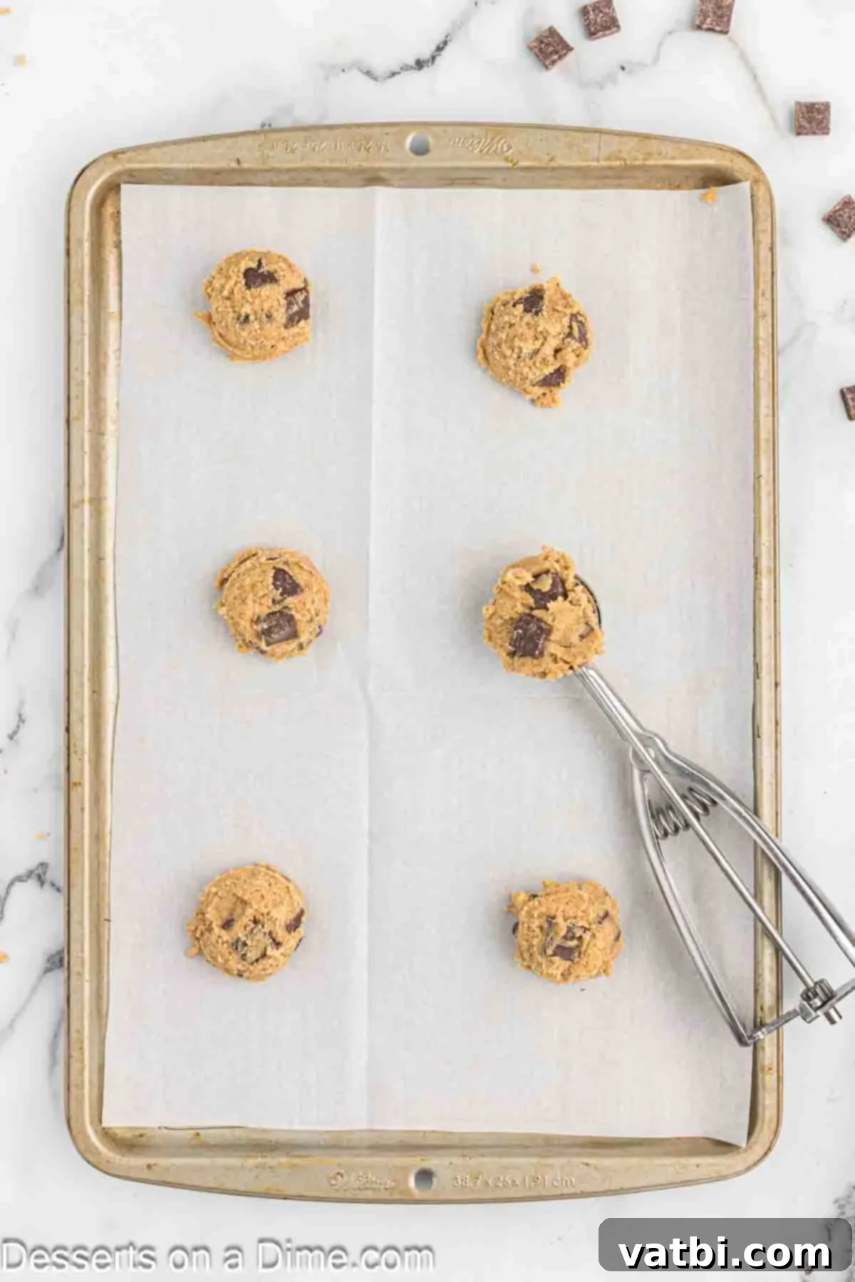 Espresso Cookies 8 Scoops of cookie dough placed on a prepared baking sheet, ready for the oven.