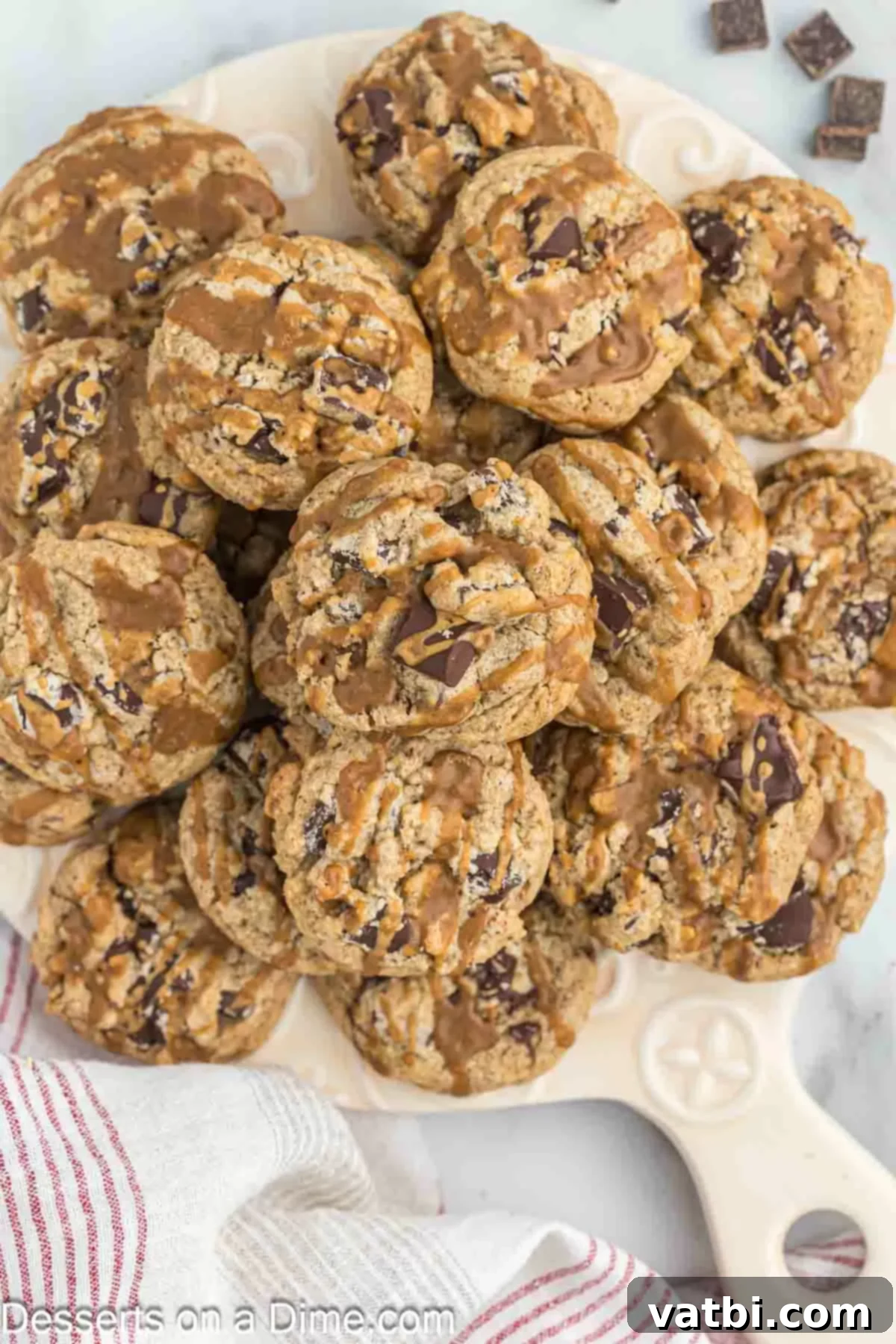 Espresso Cookies 10 Stack of freshly baked coffee cookies with coffee drizzle on a platter.