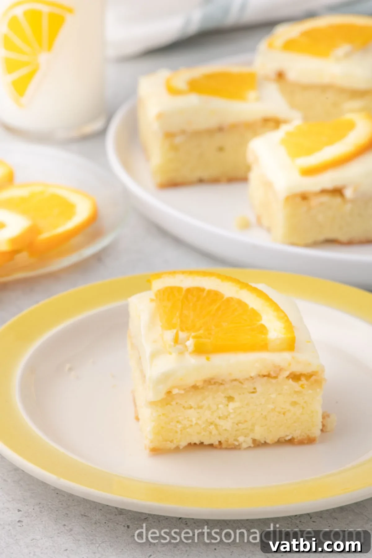 Orange Brownies 2 Slice of Orange Brownie on a plate topped with vibrant orange slices