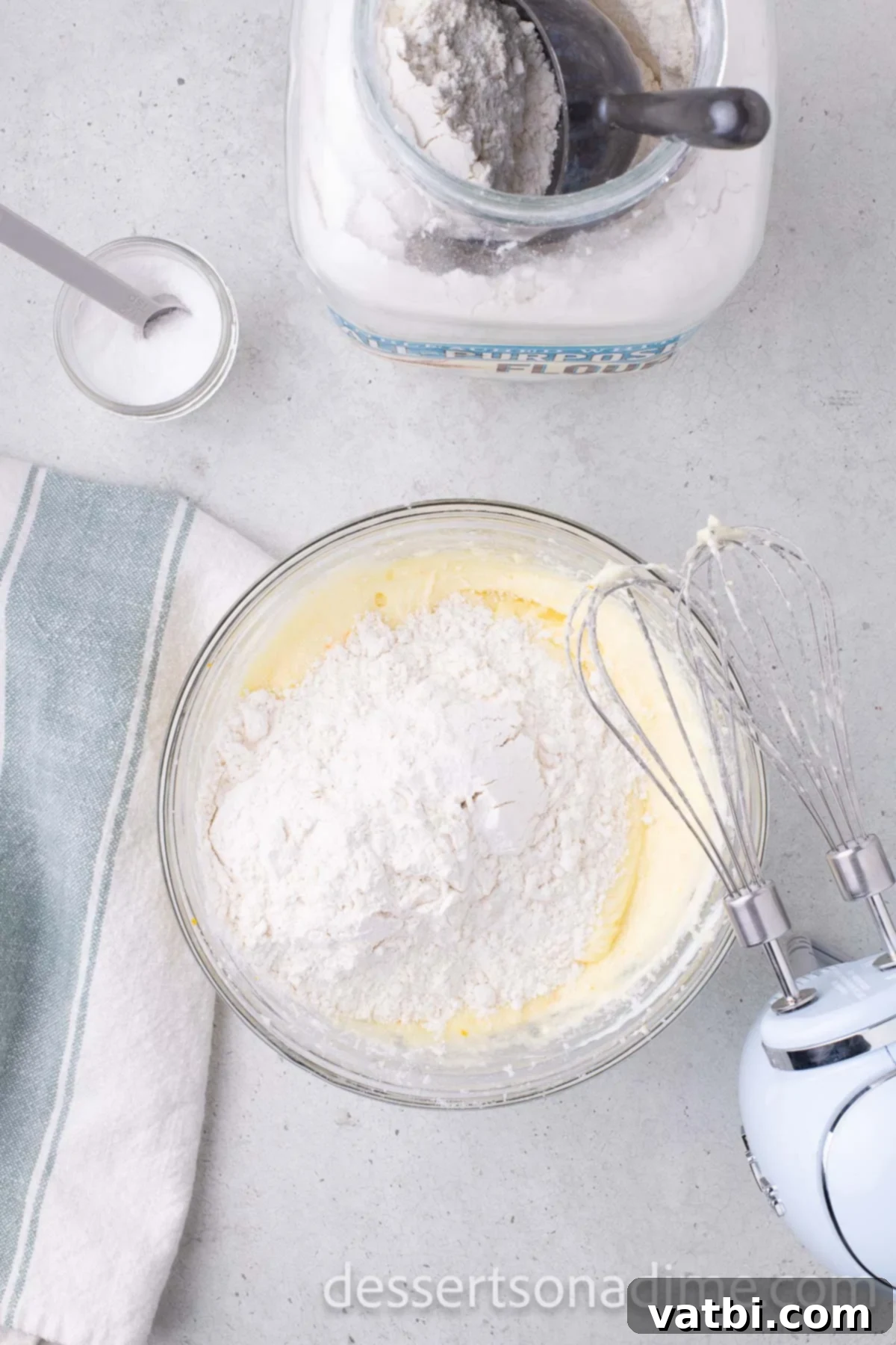 Orange Brownies 6 Dry ingredients like powdered sugar mixed into bowl.