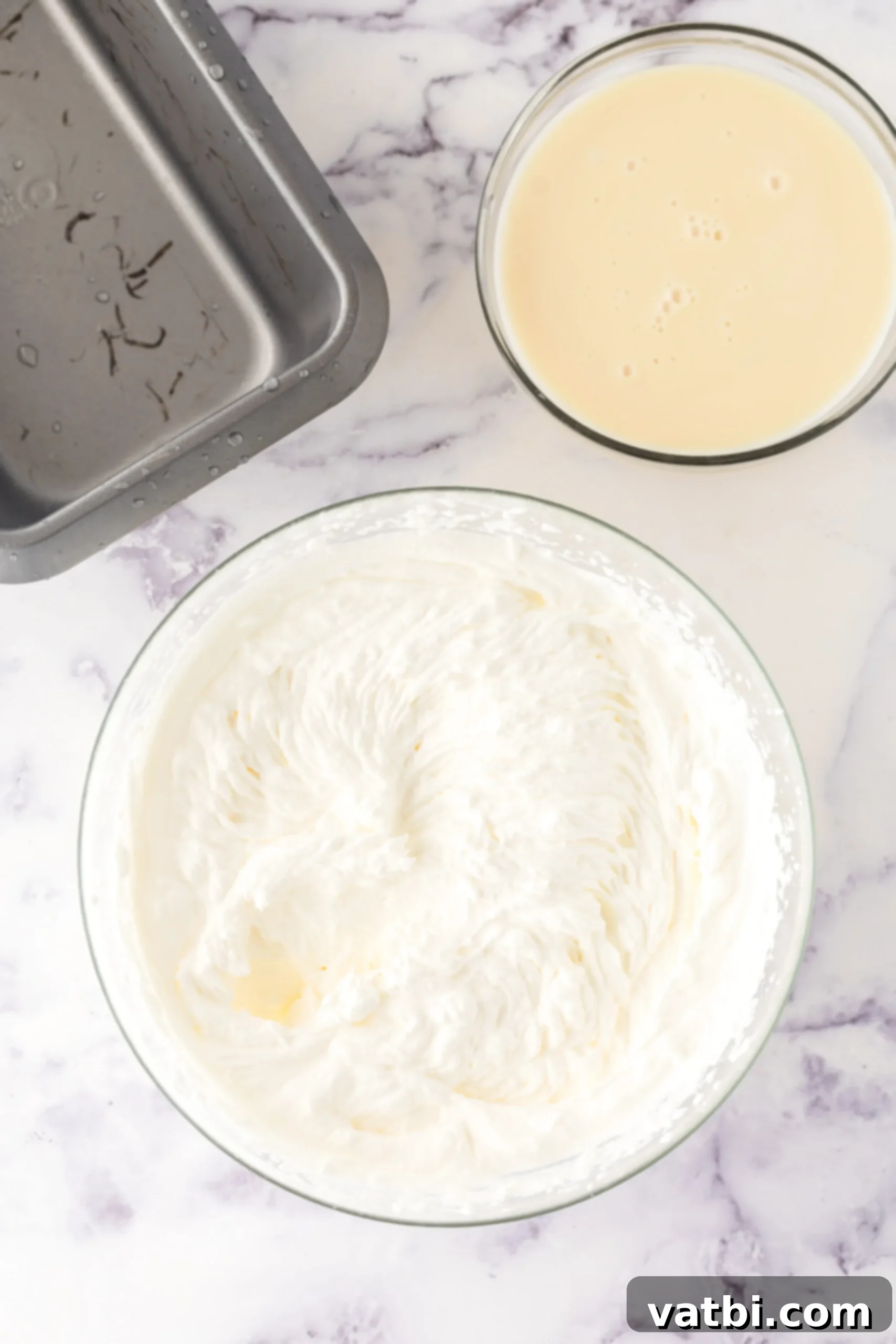 Easy No-Churn Cheesecake Ice Cream 4 Whipping cream in bowl.