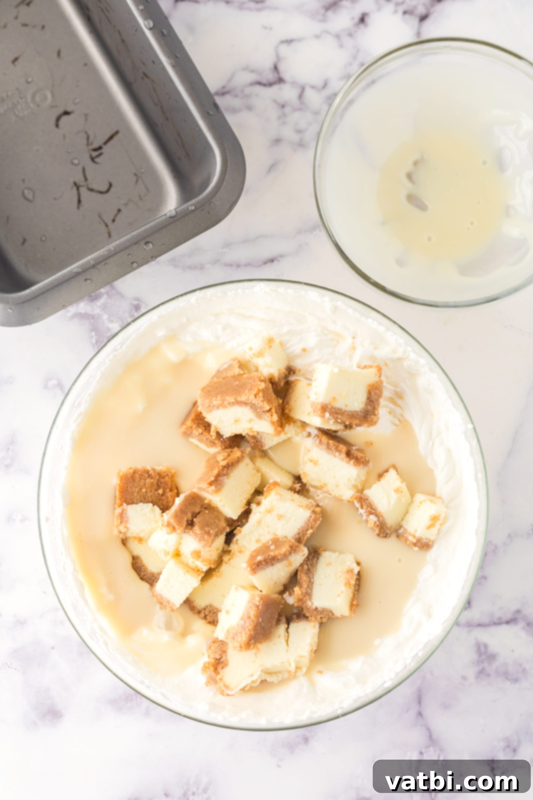 Easy No-Churn Cheesecake Ice Cream 5 Cheesecake folded into bowl.
