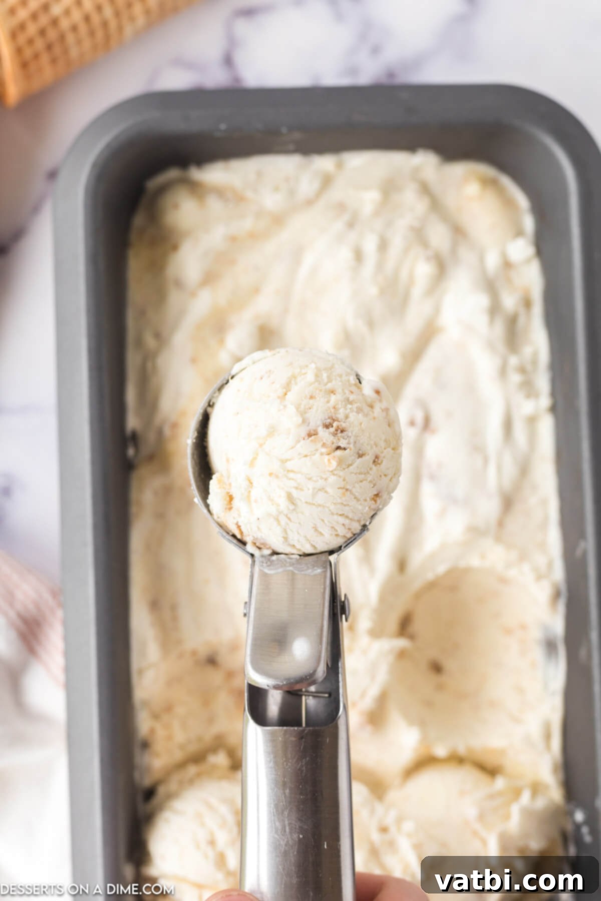 Easy No-Churn Cheesecake Ice Cream 7 Mixture scooped for serving.