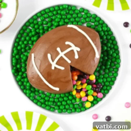 Creative Football Cake Inspiration 17 Football surprise cake revealing candies inside, a fun party idea.