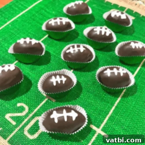 Creative Football Cake Inspiration 24 Football cake balls arranged on a platter, ideal for tailgating and parties.