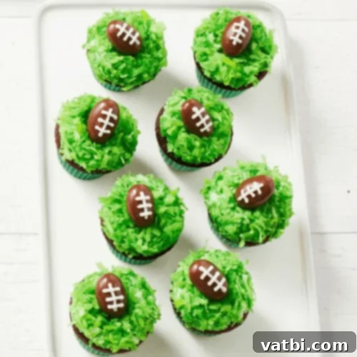 Creative Football Cake Inspiration 5 Mini cupcakes topped with green shredded coconut and almond footballs.