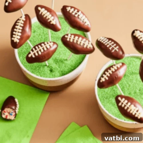 Creative Football Cake Inspiration 6 Tailgate cake pops decorated like footballs and green turf, perfect for parties.