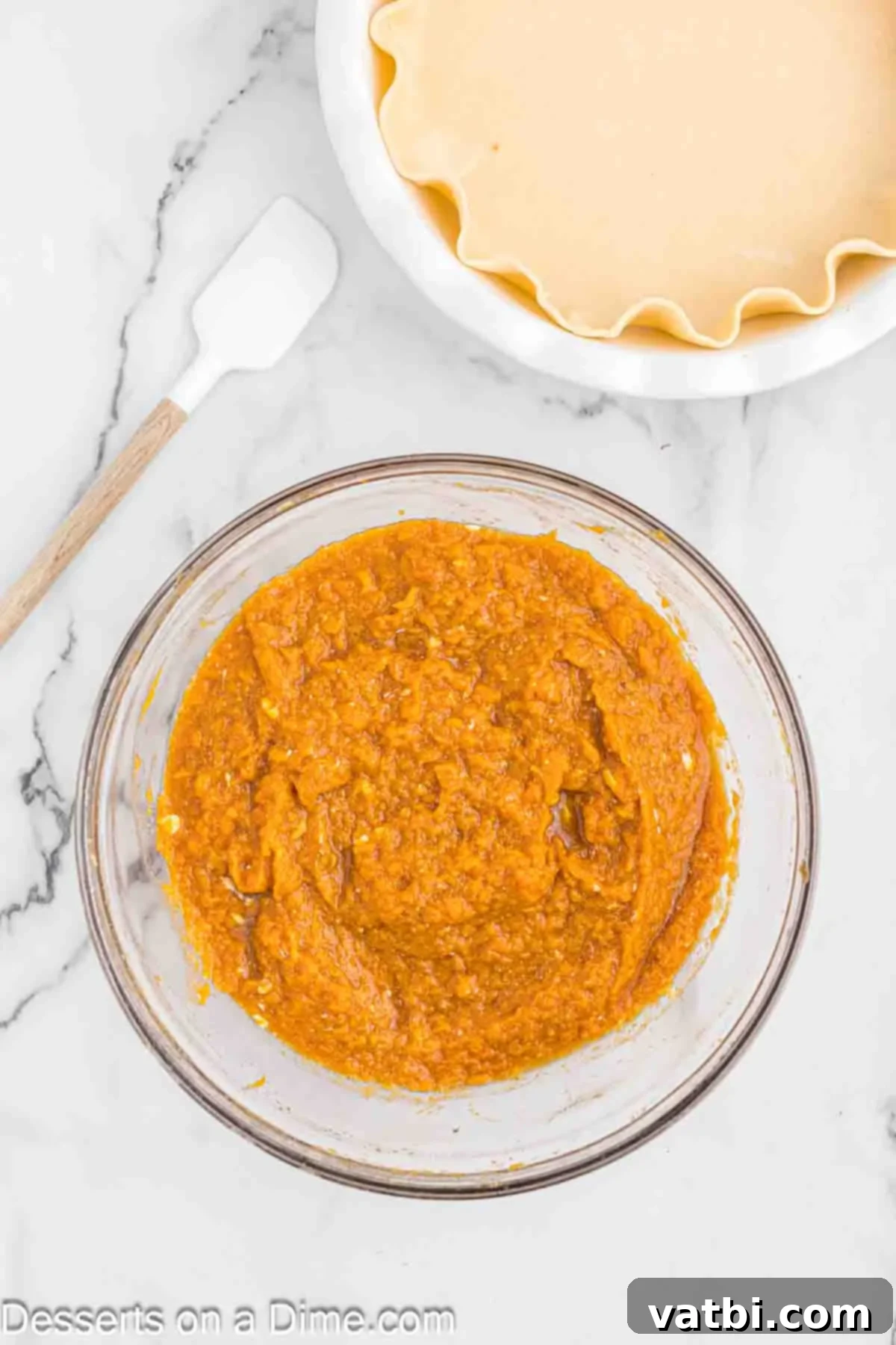 Southern Sweet Potato Pecan Pie 5 Sweet potato mixture in a bowl, thoroughly combined with spices and butter for a smooth, creamy pie filling.
