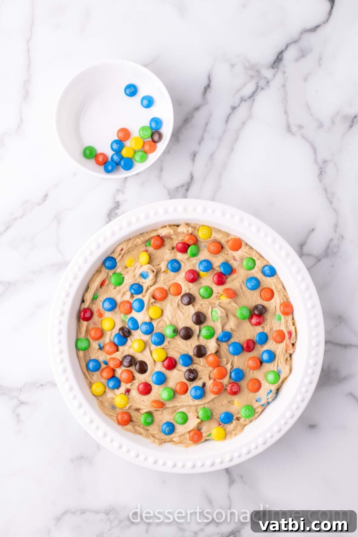 Cookie Cake mixture poured into pan. 