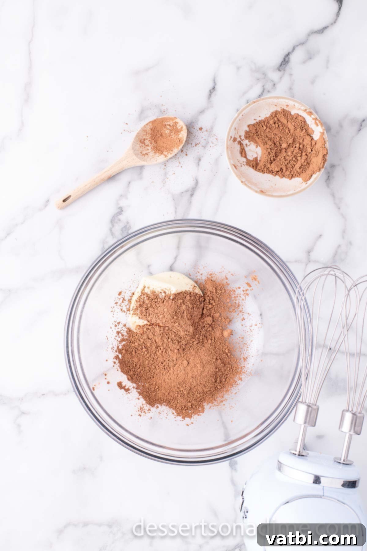 Frosting ingredients in mixing bowl. 