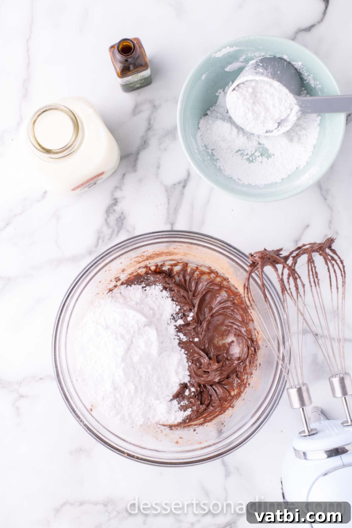 Powdered sugar added to frosting mixture. 