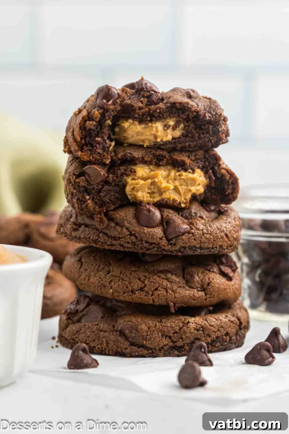 Decadent Chocolate Peanut Butter Pockets 10 Peanut Butter Stuffed Chocolate Cookies stacked together.