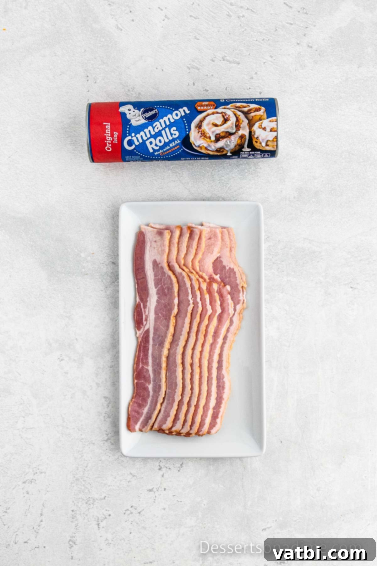 Decadent Bacon Cinnamon Buns 3 Two key ingredients for the recipe: a can of refrigerated cinnamon rolls and a pack of raw center-cut bacon.