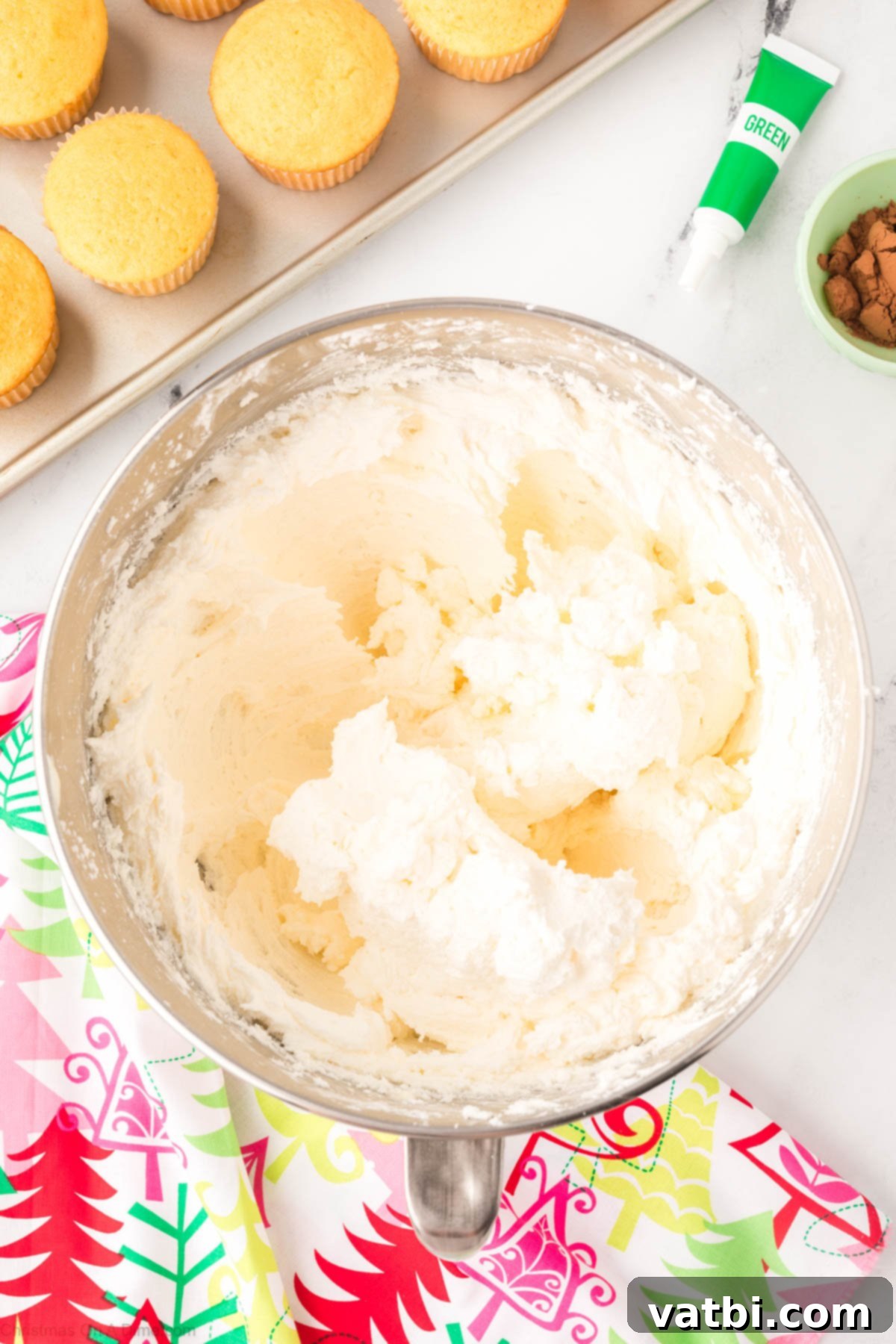 The frosting mixture after powdered sugar has been fully incorporated, showing a smooth and creamy texture.