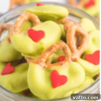 Festive Candy Treats 10 Grinch Pretzels, a sweet and salty holiday treat made with only 3 ingredients.