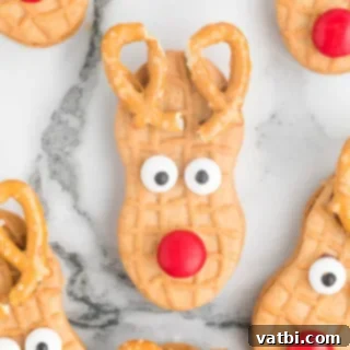 Festive Candy Treats 11 Nutter Butter Reindeers, an easy no-bake cookie perfect for the holidays.