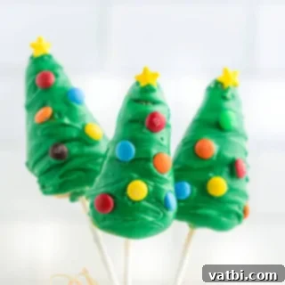 Festive Candy Treats 12 Christmas Tree Cake Pops, a fun and festive holiday dessert that is delicious and easy to make.