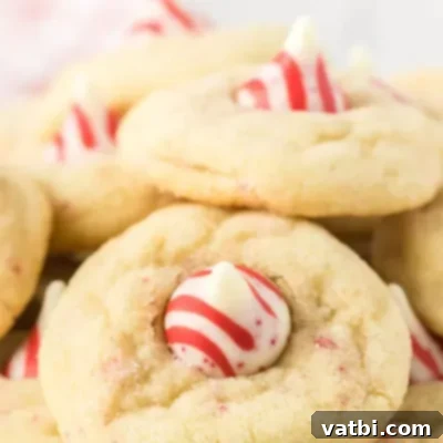 Festive Candy Treats 16 Candy Cane Kiss Cookies Recipe, a festive cookie with peppermint flavor that takes only 20 minutes to make.