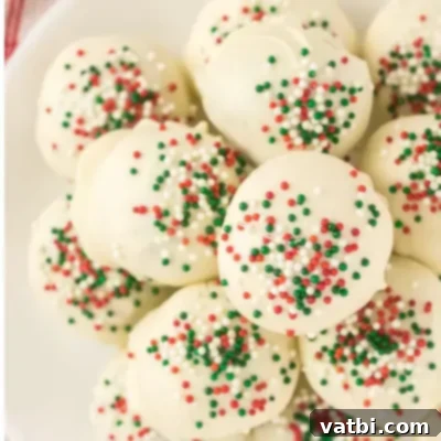 Festive Candy Treats 23 Christmas Truffles Recipe, rich and delicious truffles coated in white chocolate and festive sprinkles.