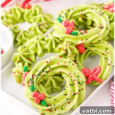 Festive Candy Treats 26 Meringue Wreath Cookies, a light, crisp, melt-in-your-mouth meringue made with egg whites, sugar, and lemon juice.