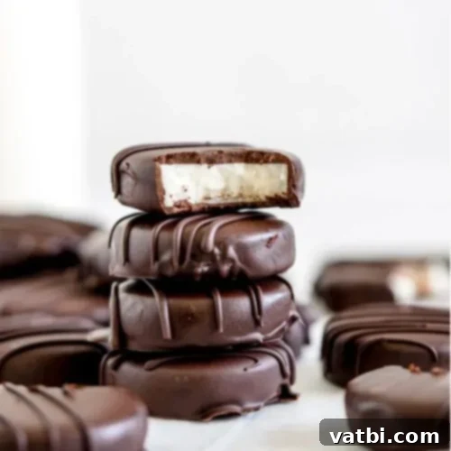 Festive Candy Treats 28 6 Ingredient Peppermint Patties, an easy homemade recipe with smooth peppermint candy filling and dark chocolate coating.