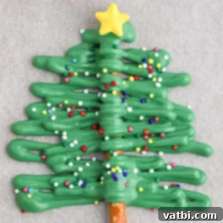 Festive Candy Treats 5 Christmas Tree Pretzels, a fun and festive holiday treat made with only 4 ingredients.