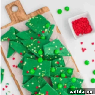 Festive Candy Treats 6 Grinch Bark, a fun and festive dessert with green candy, sprinkles, and red hearts for the holidays.