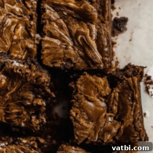 Marshmallow Fluff Delights 7 Marshmallow Peanut Butter Brownies with visible swirls of peanut butter and marshmallow.