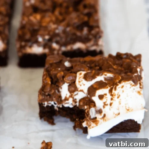 Marshmallow Fluff Delights 14 Killer Crunch Brownies with a thick layer of gooey marshmallow cream and crunchy chocolate peanut butter topping.