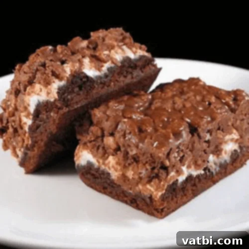 Marshmallow Fluff Delights 17 Marshmallow Krispie Topped Brownies, a delicious combination of fudgy brownies and crispy treats.