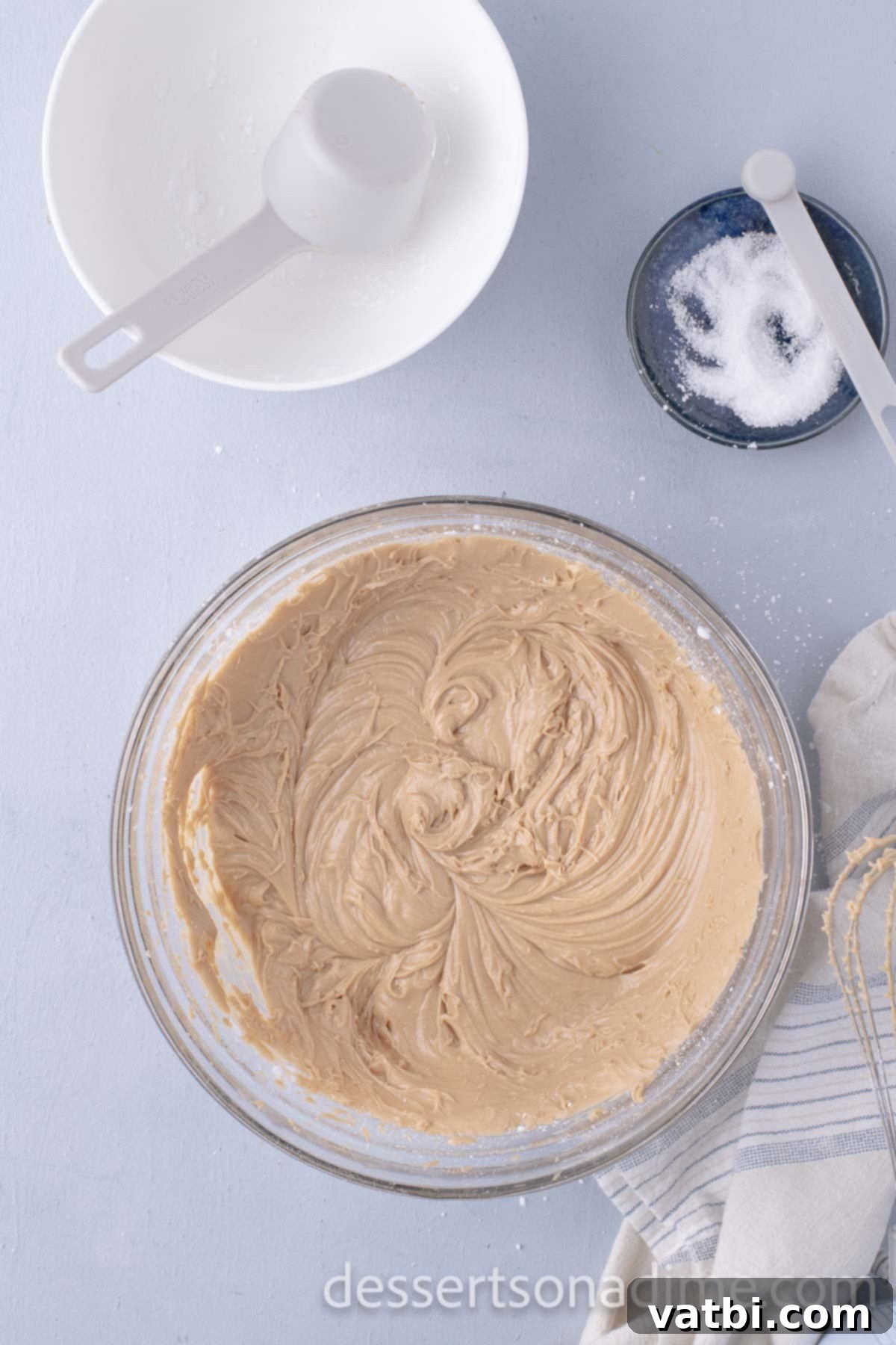 Decadent Salted Caramel Cupcakes 16 Smooth, combined salted caramel frosting in a mixing bowl, ready for piping.