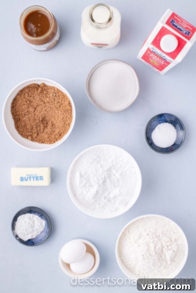 Decadent Salted Caramel Cupcakes 3 A selection of high-quality ingredients laid out for baking cupcakes.