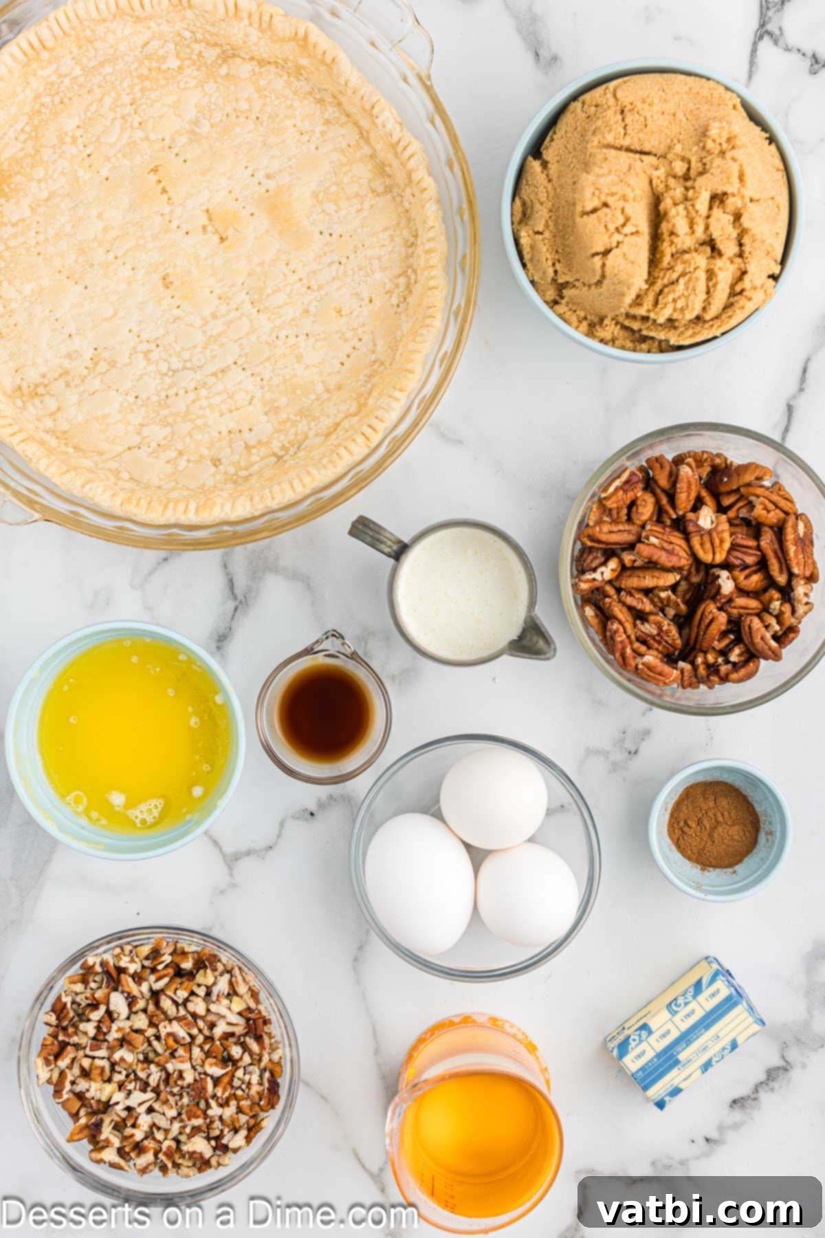 Paula Deen's Southern Pecan Delight 3 An array of fresh ingredients meticulously laid out for Paula Deen Pecan Pie, including lustrous pecan halves, a pre-made pie crust, golden corn syrup, rich brown sugar, farm-fresh eggs, pure vanilla extract, aromatic ground cinnamon, creamy butter, luxurious heavy cream, and a pile of chopped pecans.