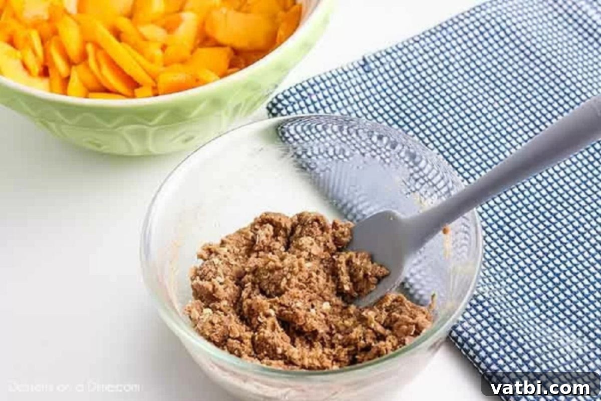Irresistible Peach Crisp 3 Separate bowl with ingredients for the crisp topping: brown sugar, flour, oats, cinnamon, and nutmeg.