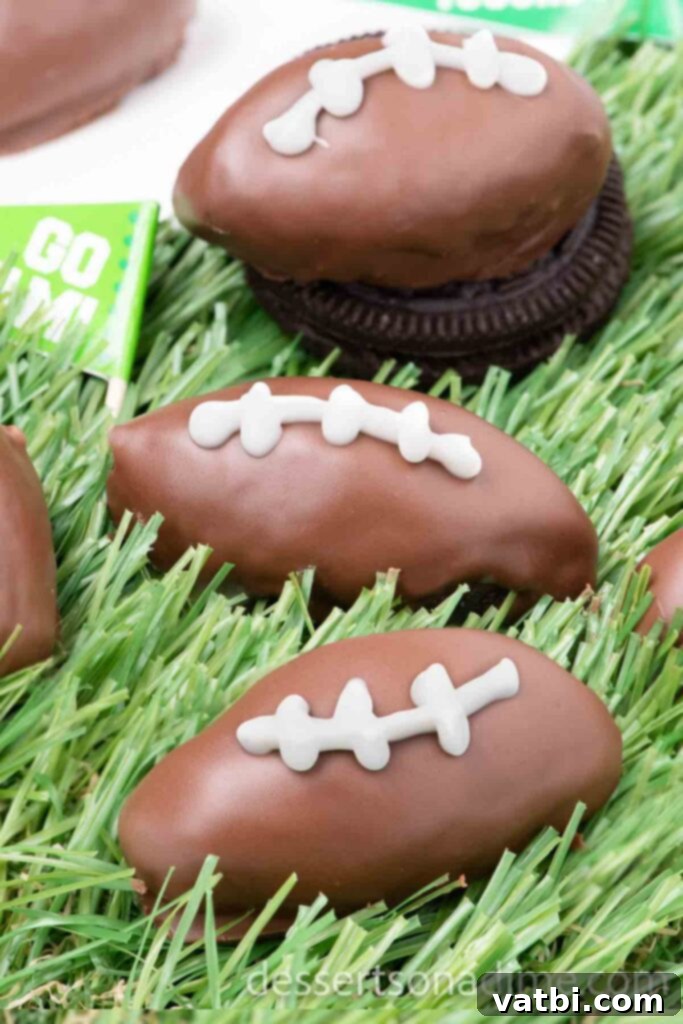 Touchdown Oreo Truffles 2 Festive Football Shaped Oreo Balls arranged on faux grass, ready for a Game Day party.