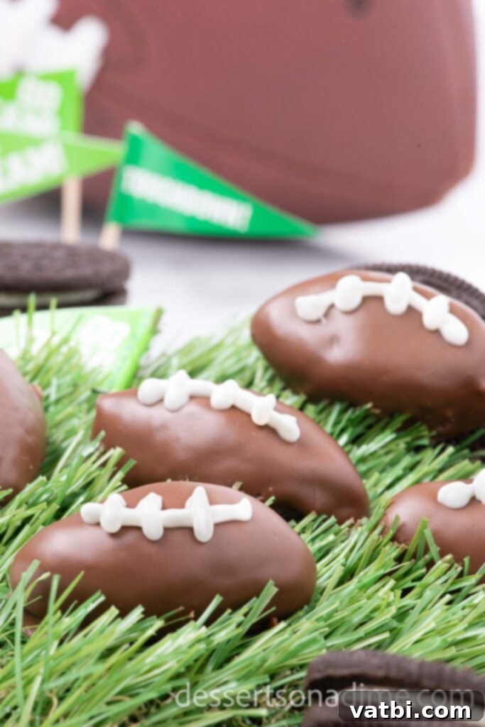 Touchdown Oreo Truffles 10 Festive Football Shaped Oreo Balls on faux grass, perfectly decorated with white laces.