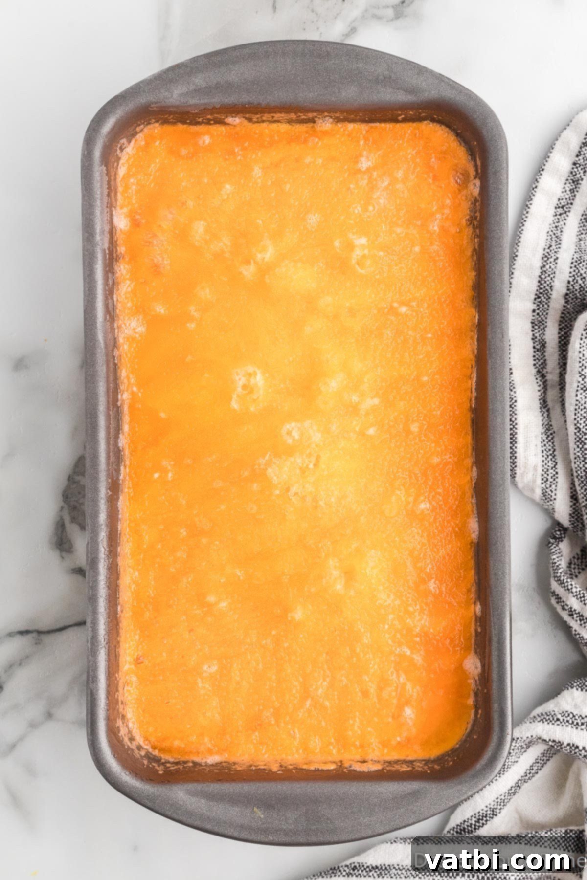 Refreshing Orange Sherbet 7 Mixture frozen in loaf pan.