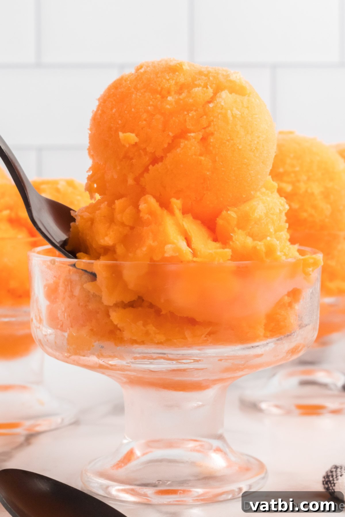 Refreshing Orange Sherbet 8 Orange Sherbet in a serving dish.
