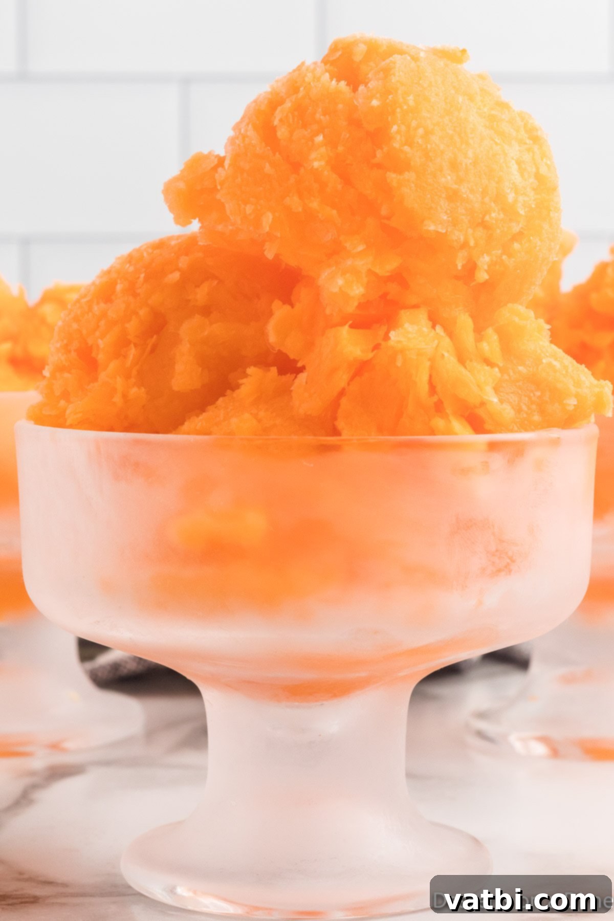 Refreshing Orange Sherbet 9 Orange Sherbet in serving dish.