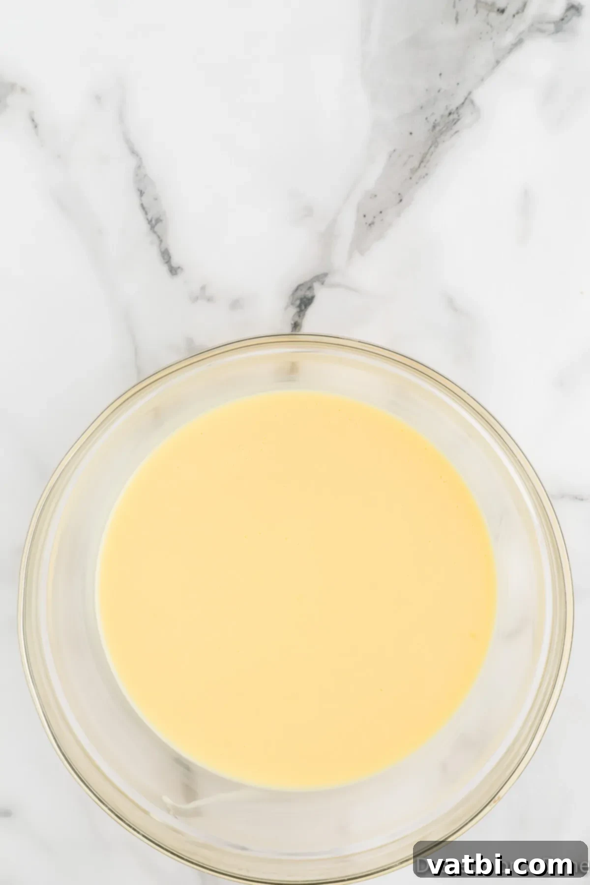 The Ultimate Magnolia Bakery Banana Pudding 4 Glass bowl with the pudding mixture chilling.