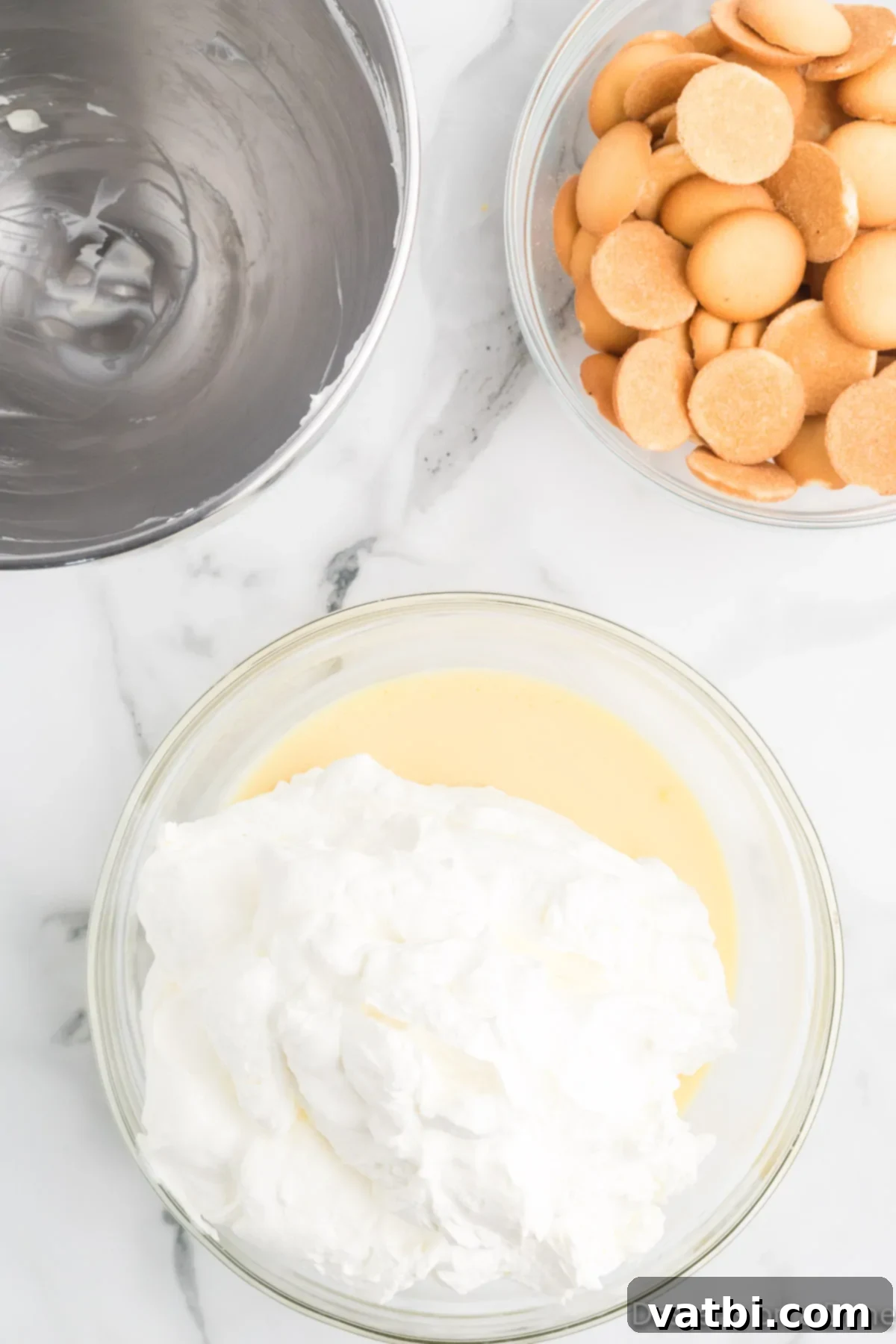 The Ultimate Magnolia Bakery Banana Pudding 6 Bowl with whipped cream gently folded into the pudding mixture.