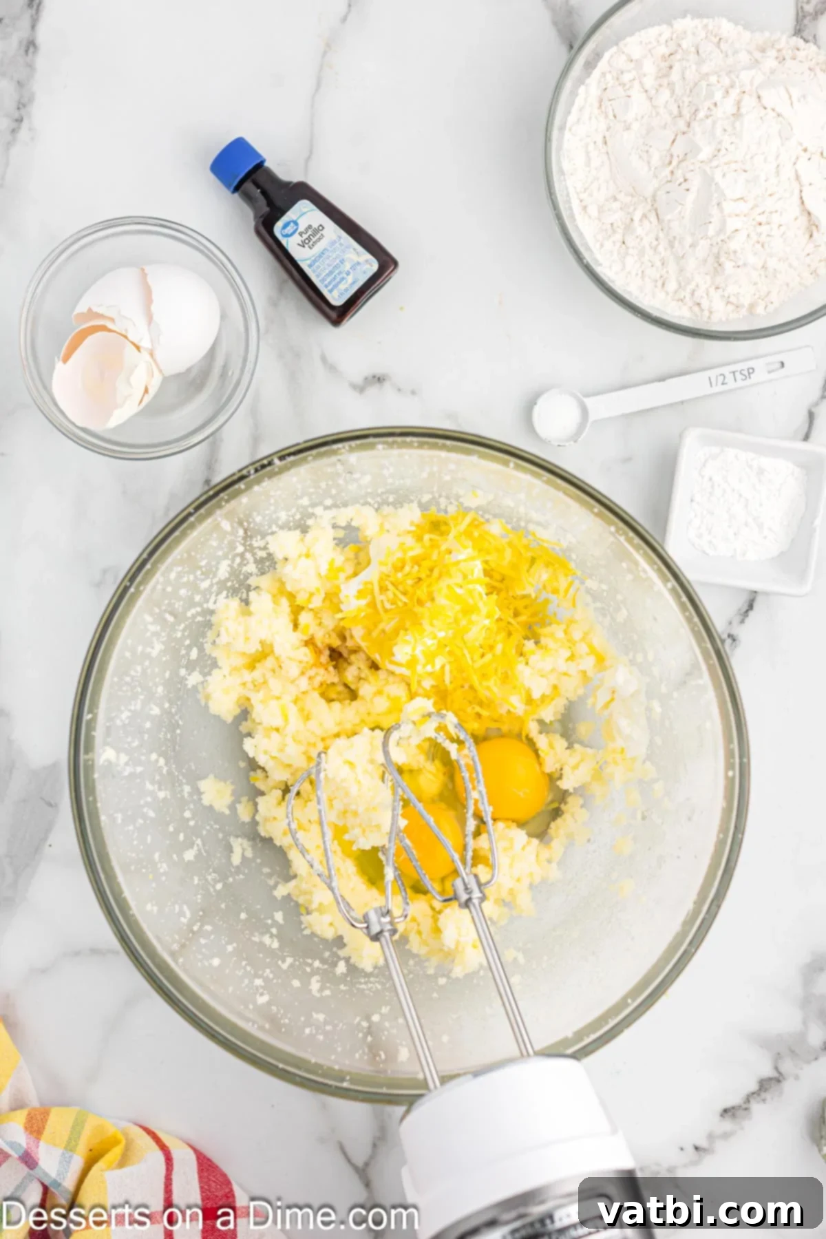 Sun-Kissed Lemon Raspberry Treats 5 Mixing bowl with eggs and sour cream added.