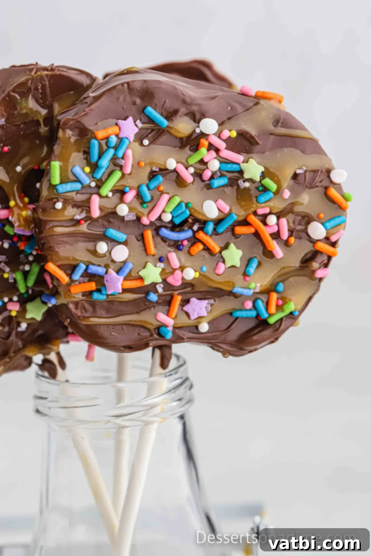 Caramel Apple Slice with sprinkles in a jar standing up. 